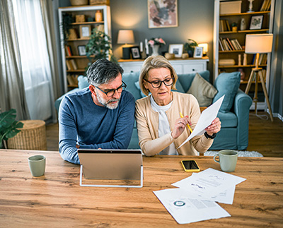 senior couple reviewing medical deduction paperwork